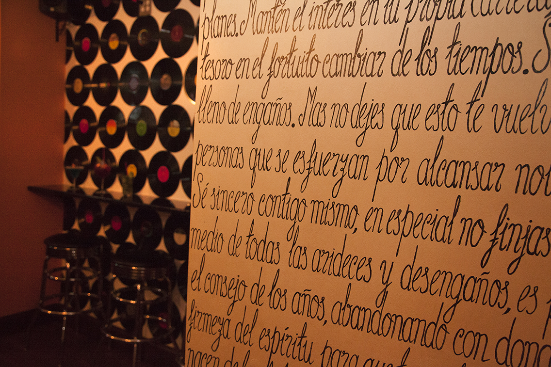 Decorative writing and record wall inside the restaurant