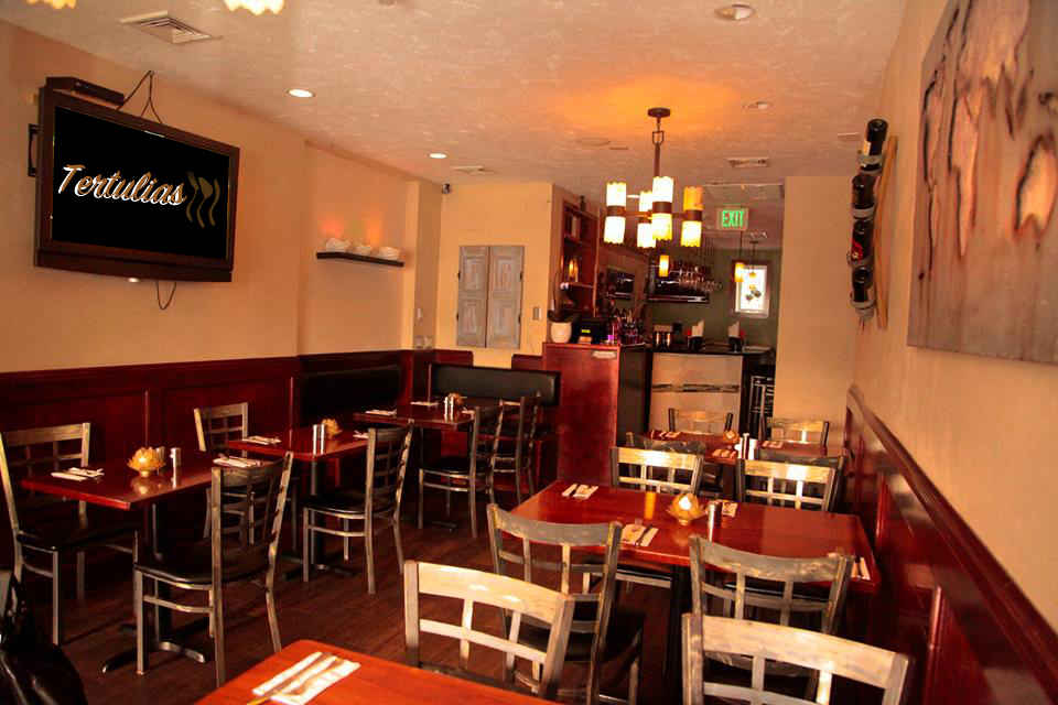 Warm dining room inside Tertulias Cafe
